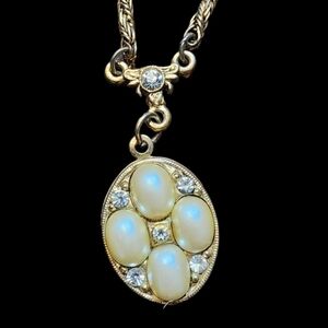 Elegant Gold and Cream Locket Necklace